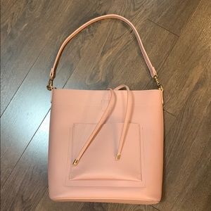 Madison West Pink Bucket Bag with multiple straps and pockets